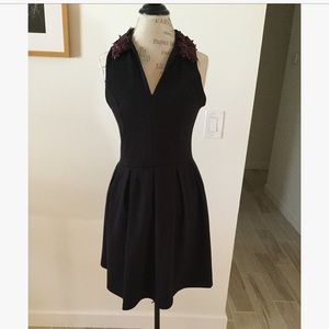 Black fit and flare dress with flower collar